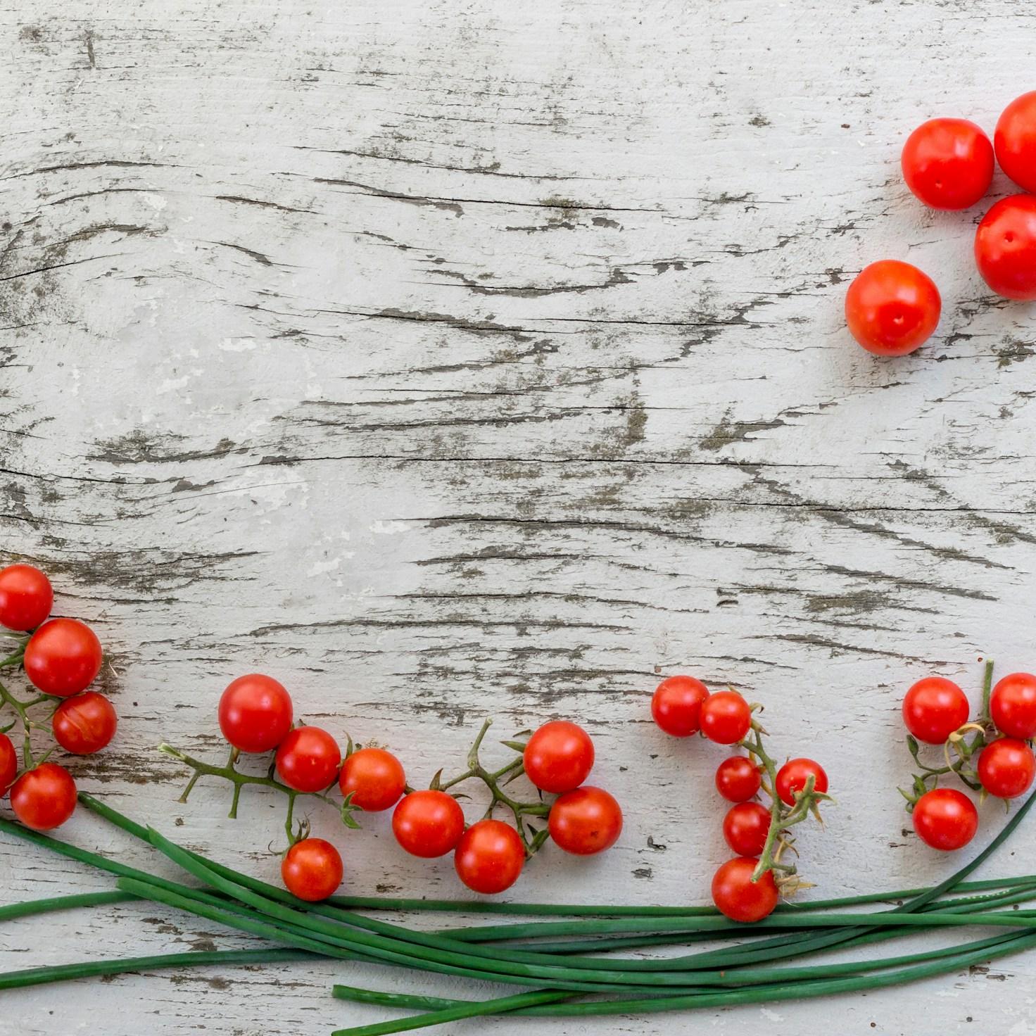 Community members collaborating in a modern kitchen space, sharing recipes and cooking techniques